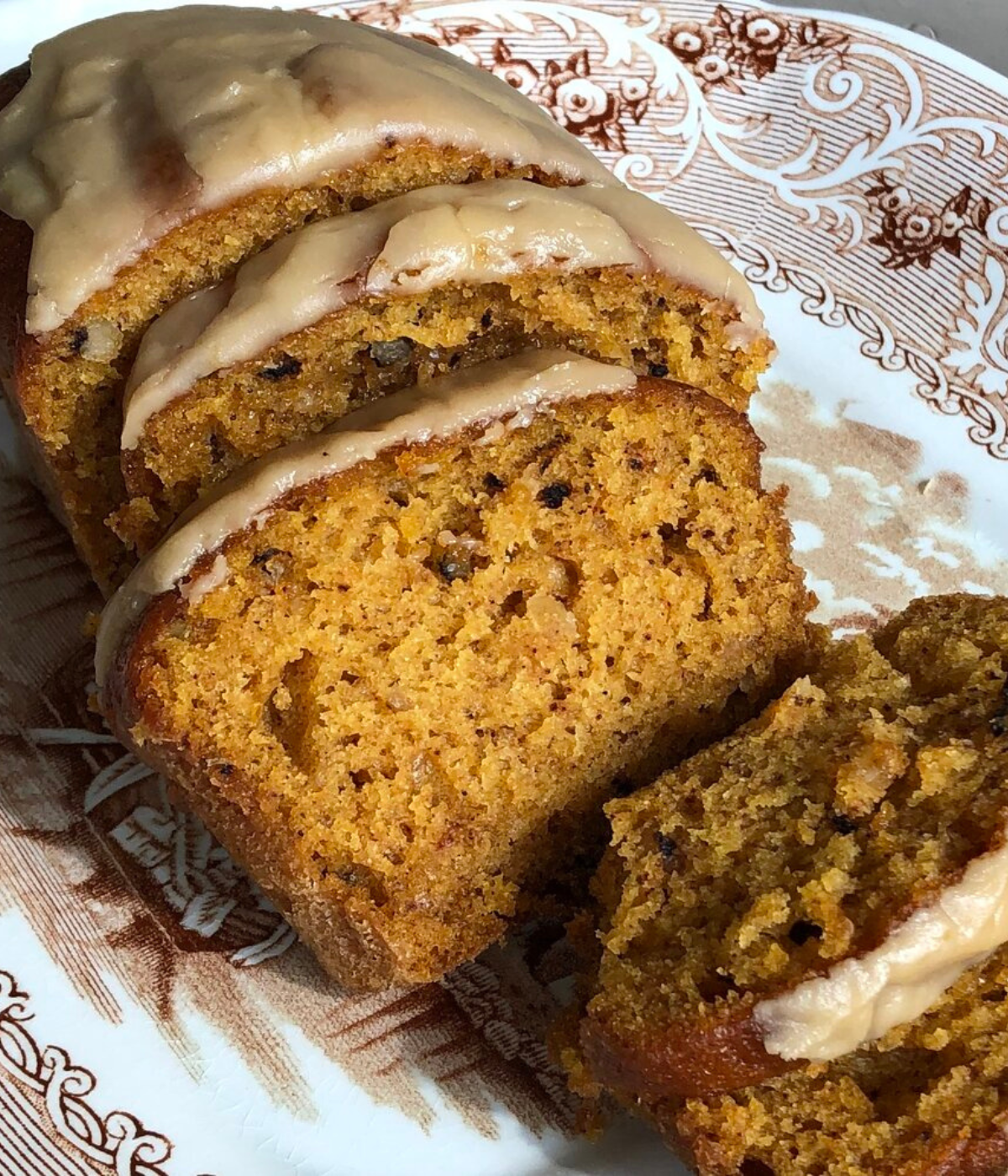 sliced pumpkin bread with cream cheese frosting