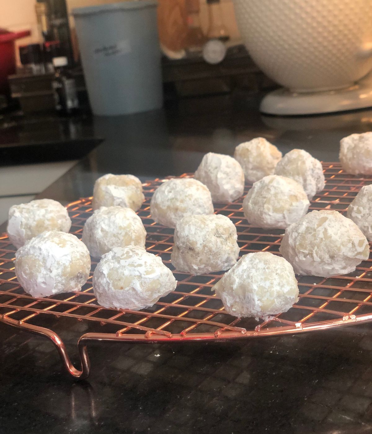 Russian tea cakes on a cooling rack